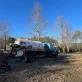 A Brown Trout Septic truck is parked